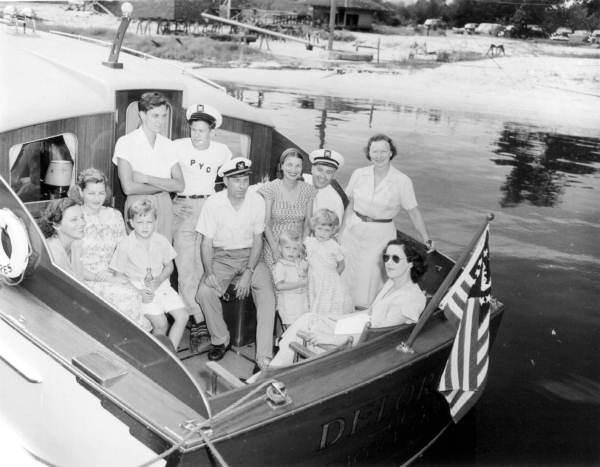 Part of a committee to welcome the Eastward Ho cruise at Pensacola are gathered in the back of a boat