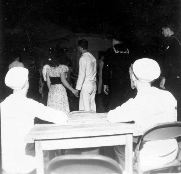 Sailors watching people dancing at the YMCA service club - Key West, Florida
