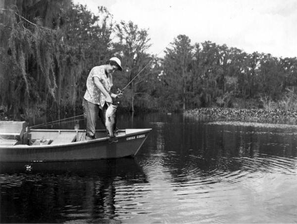 Teresa Meyers landing an 8 pound bass - Cross Creek, Florida