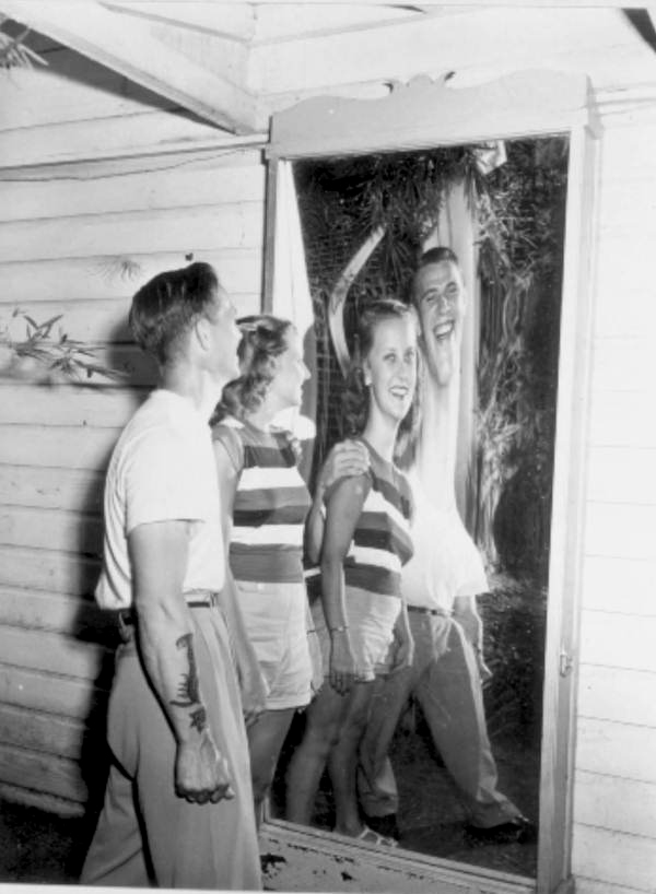Bernard Buck and Phyllis Trask stand before a funny mirror