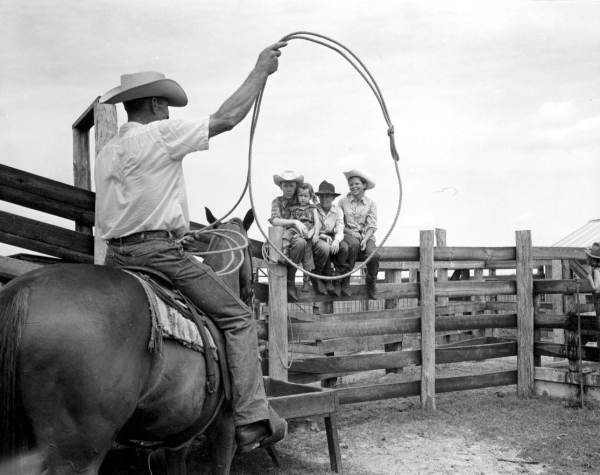 Edward Partin gives roping instructions to young children at the Heart Bar Ranch - Kissimmee, Florida