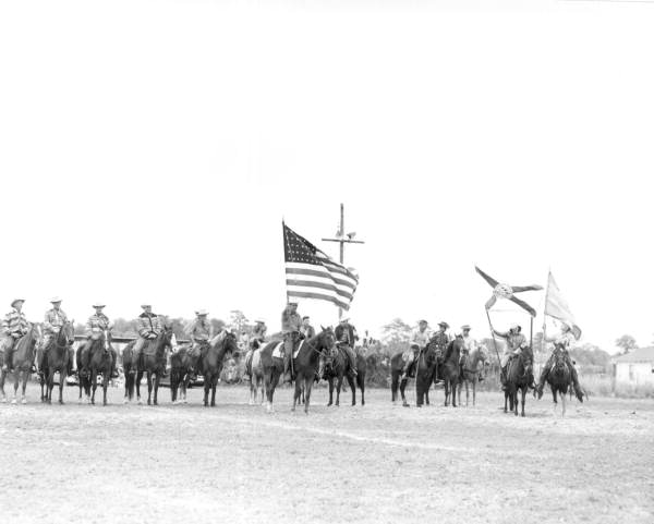 Cowboys with flags - New Smyrna Beach, Florida .