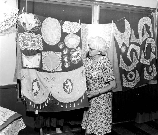 Lady with a display of needlework - Miami, Florida