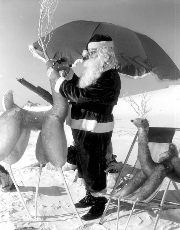 Santa furnishing reindeer with sunglasses - Panama City Beach, Florida.