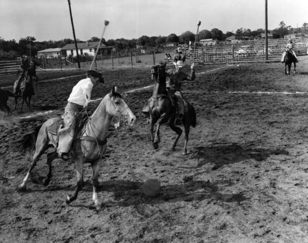 Unidentified men on horses play a game - New Smyrna Beach, Florida .