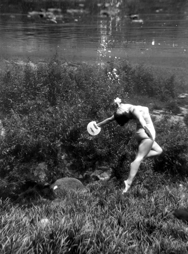 Swimmer performs beneath the water - Dunnellon, Florida .