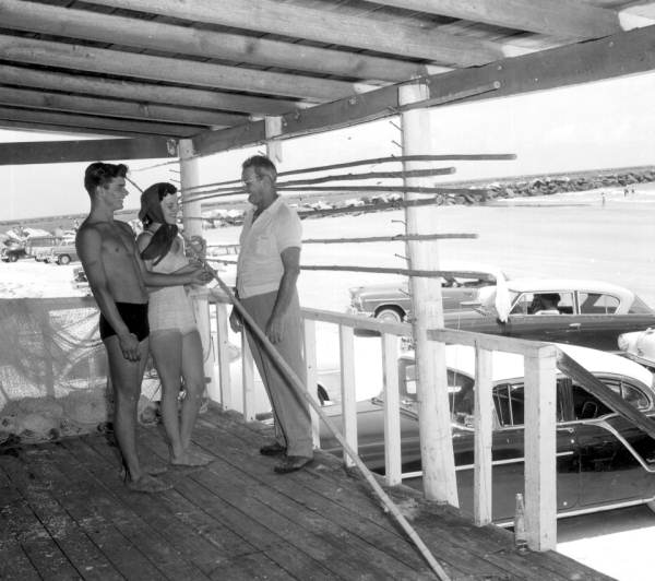 Robert "Kelly" Worely gives fishing advice to two youngsters - Mayport, Florida