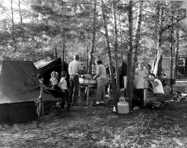 Families cooking beside their deer hunting camps - Umatilla, Florida.