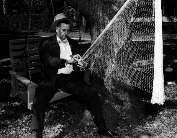 H. O. Marshall knitting a cast net - Apalachicola, Florida