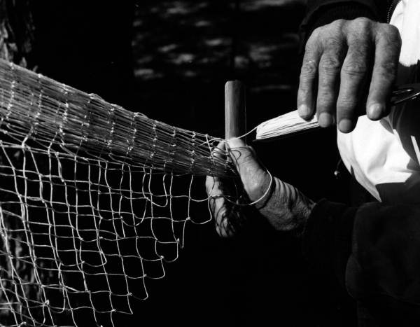 H. O. Marshall knitting a cast net - Apalachicola, Florida