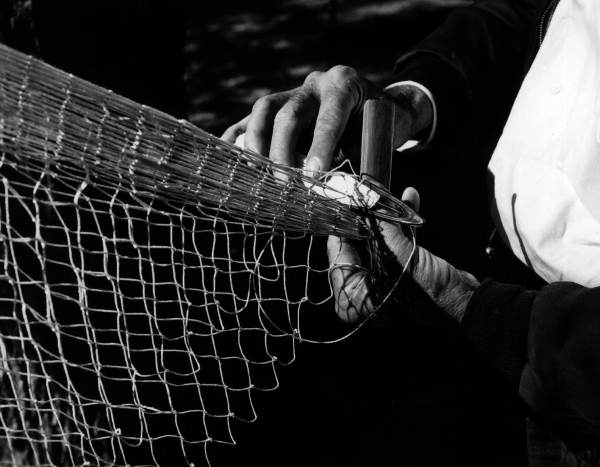 H. O. Marshall knitting a cast net - Apalachicola, Florida