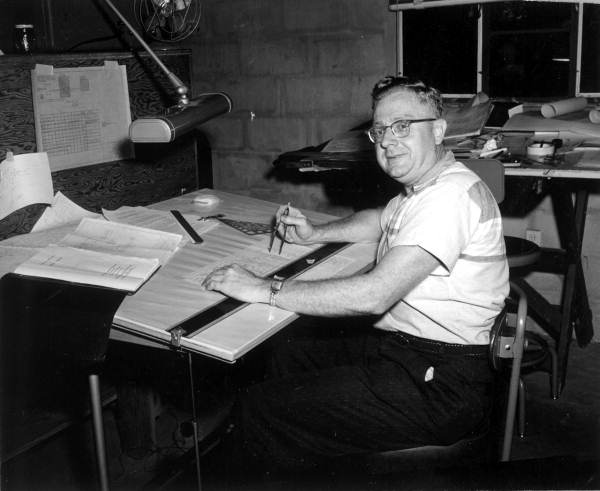 Director of Research Carl Vossberg at a drafting room in The Electron-Machine Corporation - Umatilla, Florida.
