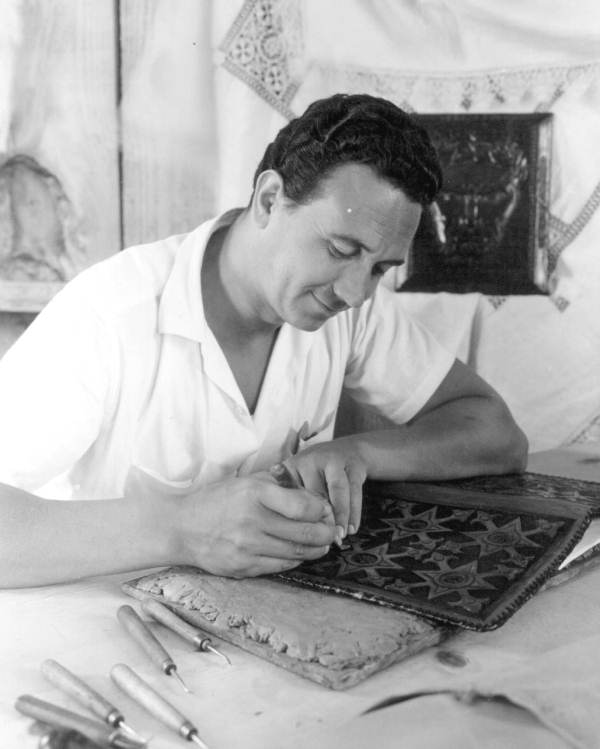 Leather decorator at work at the Quadricentennial Festival - Pensacola, Florida