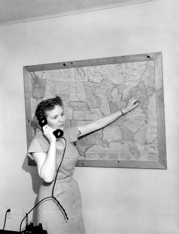 Flower broker, Margaret Haliczer works on the phone - Lee County, Florida .