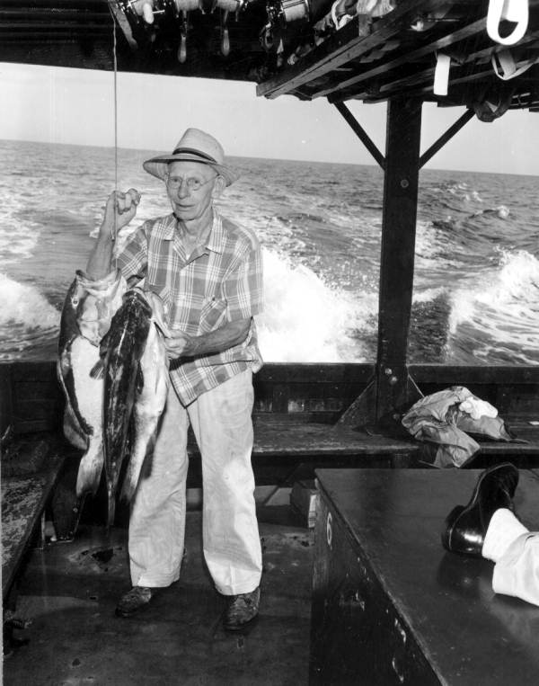 John Hundley proudly displaying his string of grouper - Franklin County, Florida