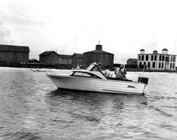 Family passing Santa Rosa Island during their boating excursion.