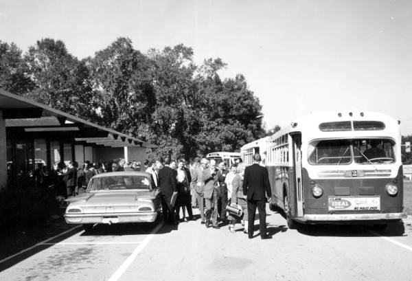 Participants of the Housing and Living Arrangements for the Elderly conference boarding city buses - Tallahassee, Florida