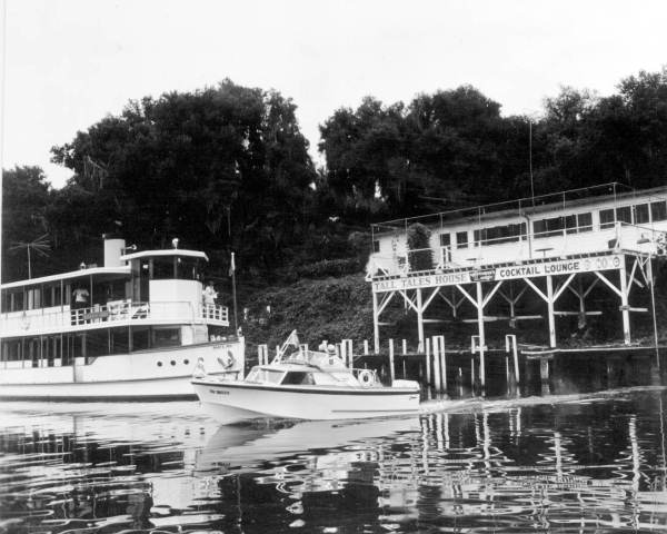 View of boat passing in front of Noah's Ark by the Sportsman's Lodge.