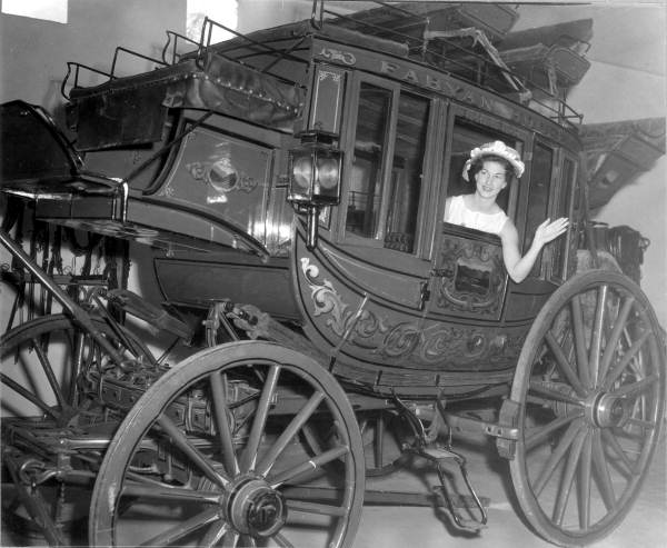 Deane Martin sitting inside stagecoach- Silver Springs, Florida.