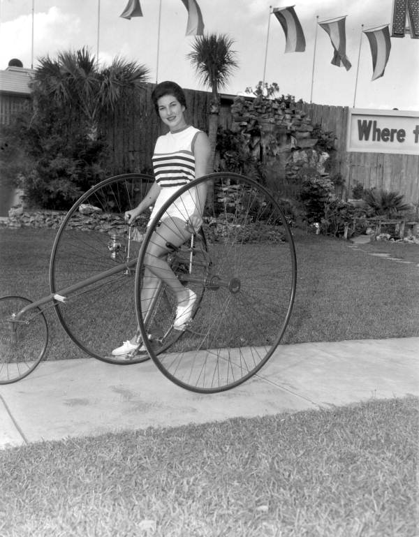 Deane Martin riding large antique tricycle- Silver Springs, Florida.