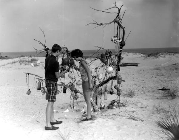 People in the process of making an art piece in Apalachicola