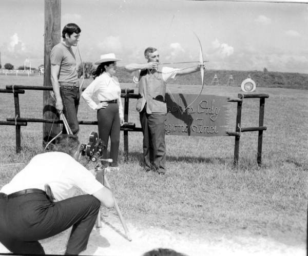 A photographer shooting pictures of archery at River Ranch Acres - Polk County, Florida.