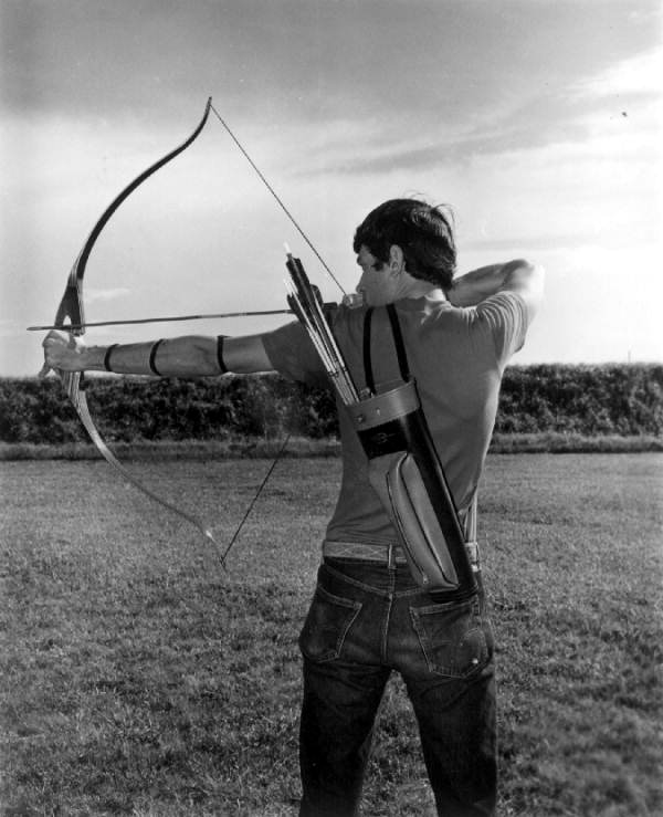 An archer takes aim to shoot arrow at River Ranch Acres - Polk County, Florida.