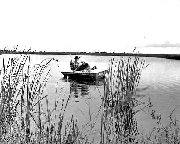 Two men fishing at River Ranch Acres - Polk County, Florida.