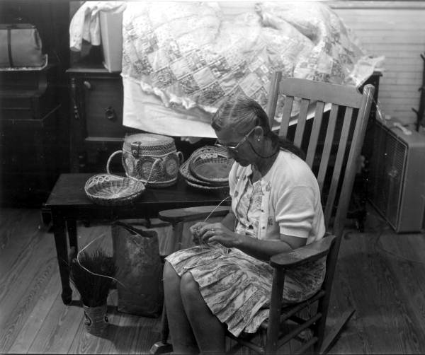 Woman weaving a basket in Adam's country store - White Springs, Florida