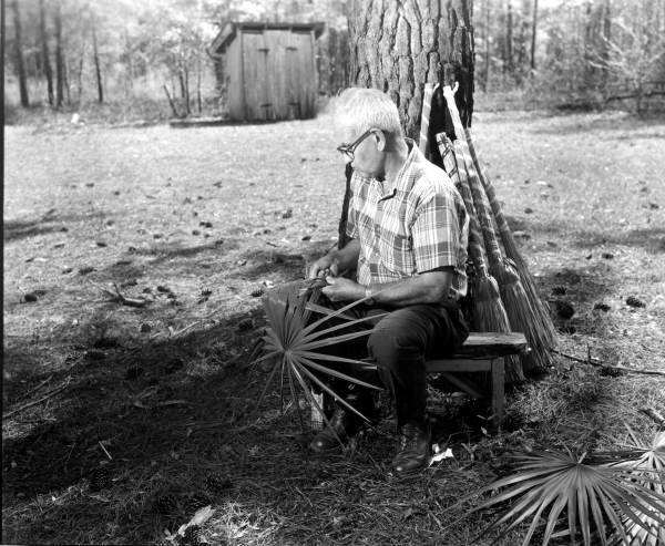Man weaving palmetto fronds