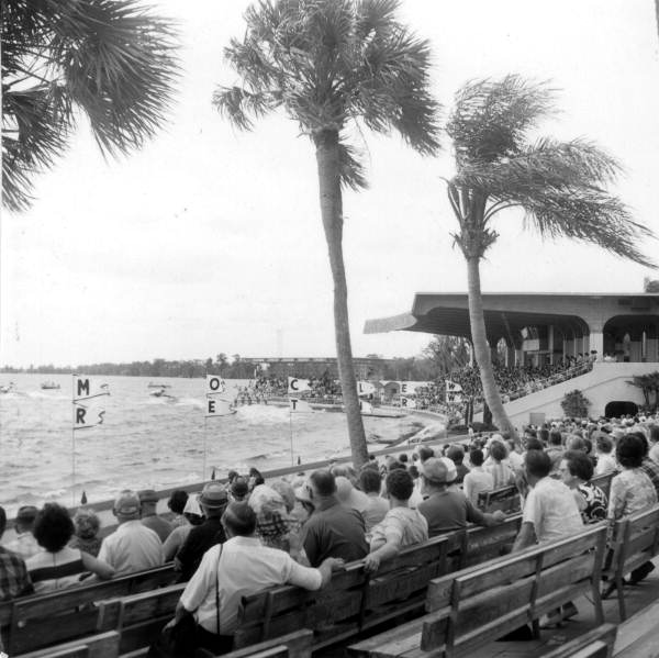 Spectators watching motorboat and water skiers at Cypress Gardens - Winter Haven, Florida