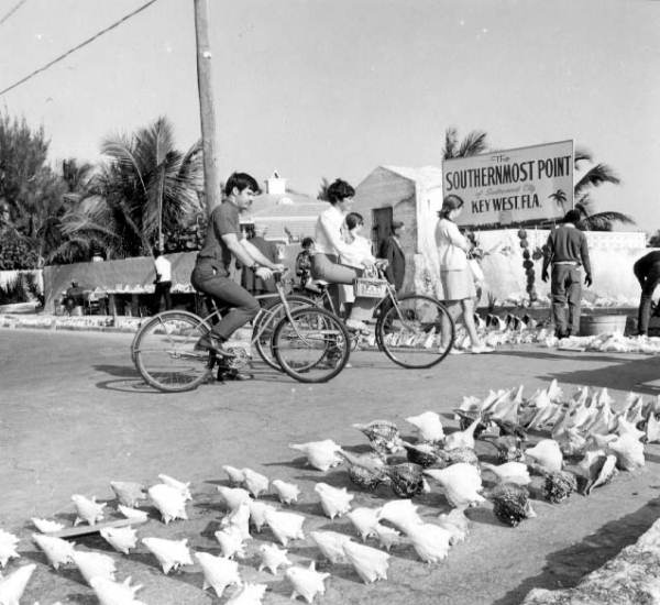 Cyclist and sightseers at the southernmost point - Key West, Florida