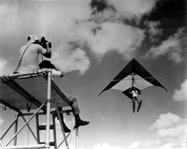 Two men filming a hang glider- Cypress Gardens, Florida