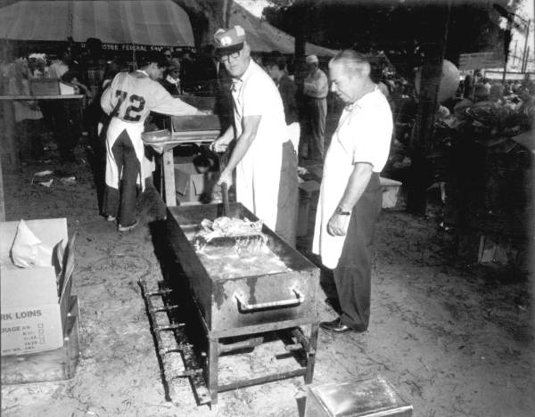 Men frying fish at the Florida Seafood Festival - Apalachicola, Florida