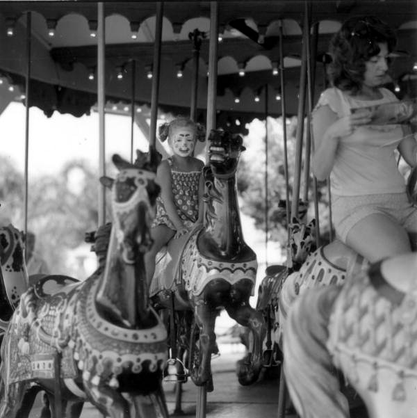 Child riding merry-go-roundOrlando, Florida