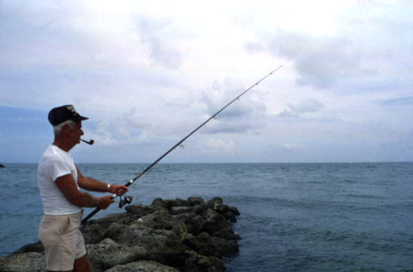 Man fishing at Sebastian Inlet State Park - Melbourne Beach, Florida.