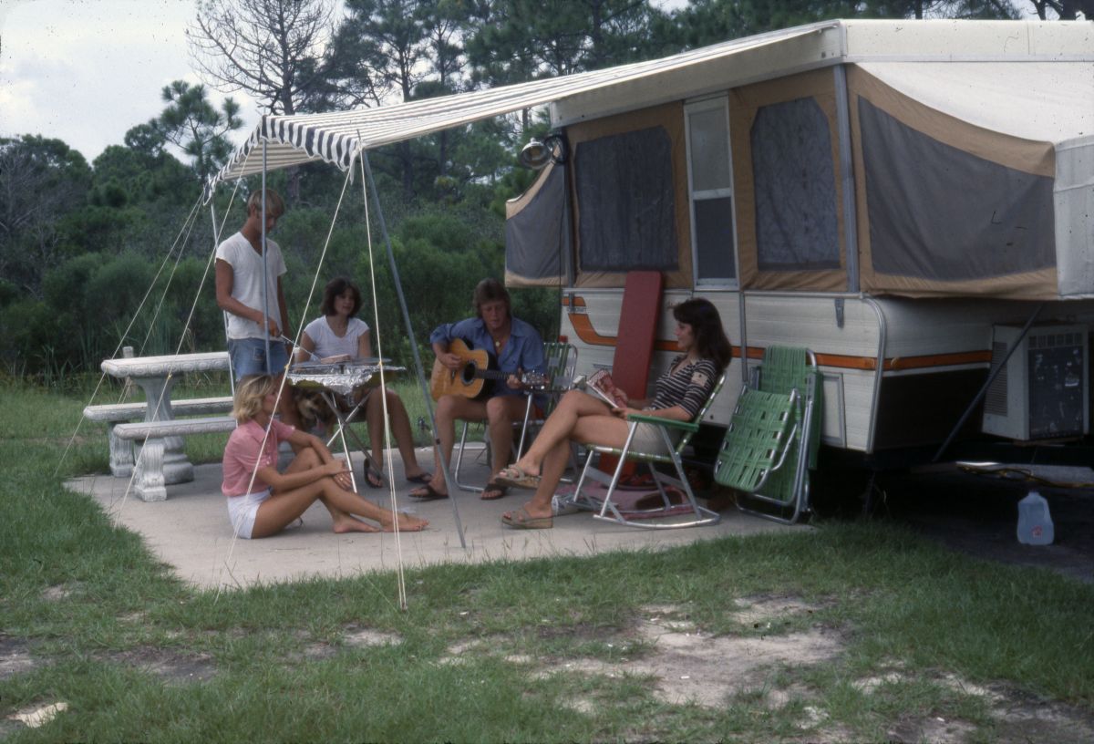 People picnicking near camper at St. Andrews State Park - Panama City, Florida..