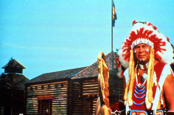 Man in Native American costume at the Fort Liberty dinner show attraction in Kissimmee, Florida.