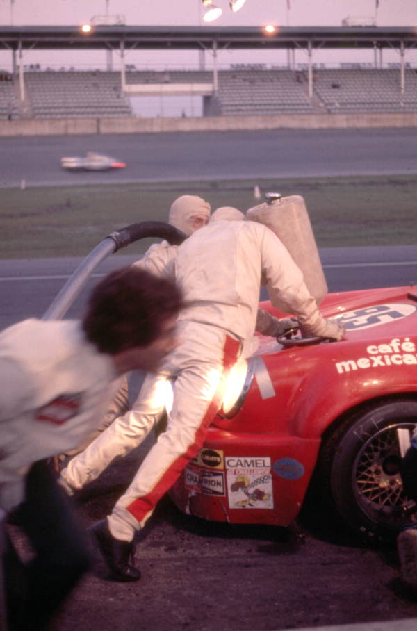 Pit crew fueling Porsche car 95 during the 24 Hours of Daytona race at the Daytona International Speedway racetrack.