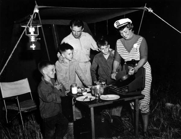 A lady cooking for her family at camp - Kissimmee River, Florida