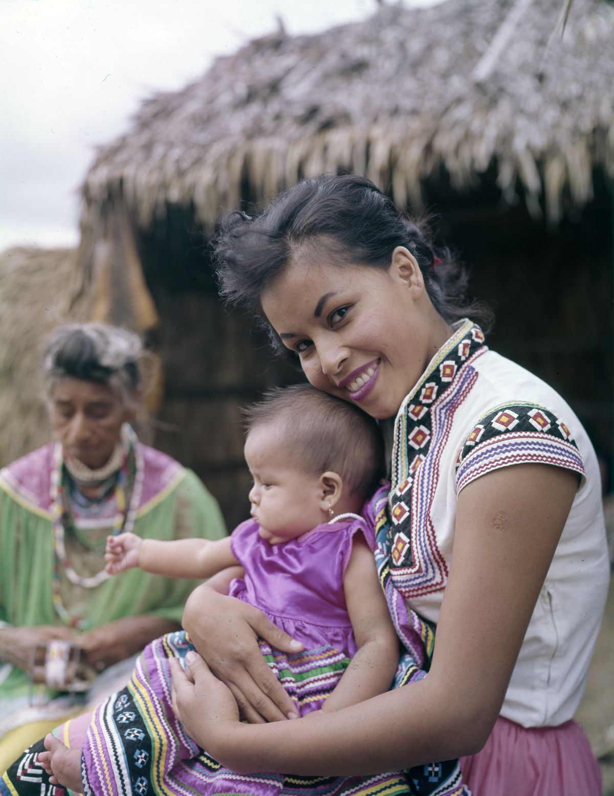Outdoor portrait of Marie Osceola with her daughter Tammy at the Seminole Okalee Indian Village on Dania Reservation.