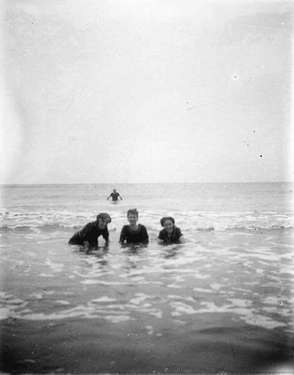 Four figures in surf
