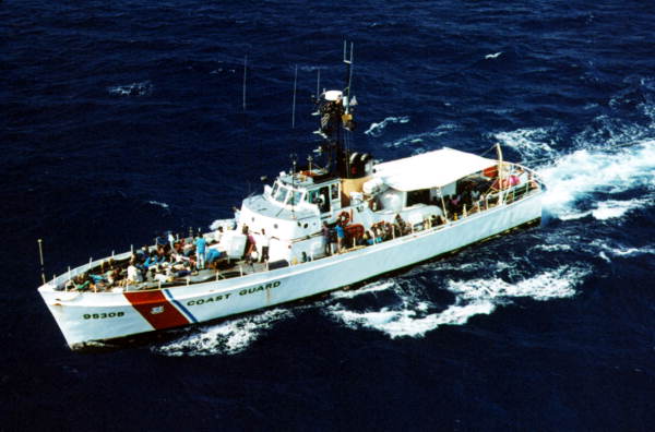 USCG cutter "Cape Strait" under way off Key West, Florida with Haitian refugees on board after intercepting them..