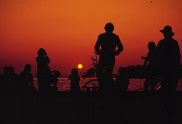 People enjoying a sunset at Mallory Square - Key West, Florida.