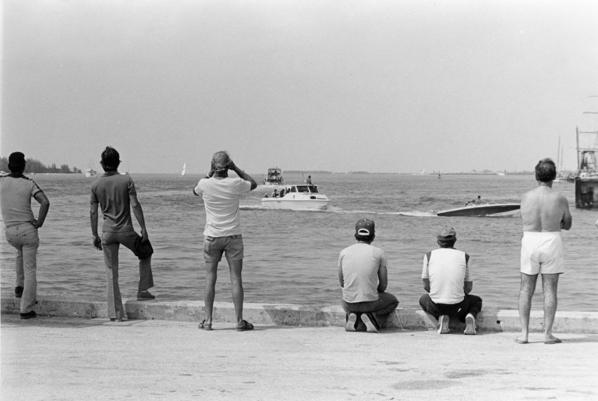 Cuban Americans scan arriving boats for friends and relatives during the Mariel Boatlift - Key West, Florida.
