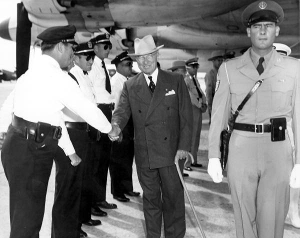 President Truman shaking hands with members of police department prior to his departure - Key West, Florida.