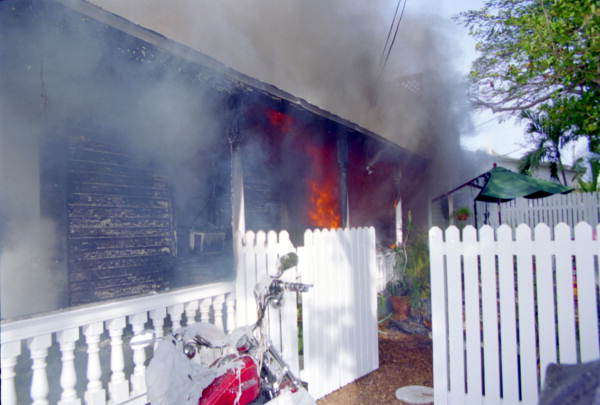 View of house fire on 1709 Flagler Ave. from the east side of the structure showing fire..