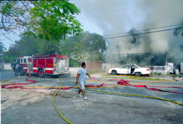 Over view of firefighting efforts at the house fire at 1709 Flagler Ave. Eng. Co. #8 at left..