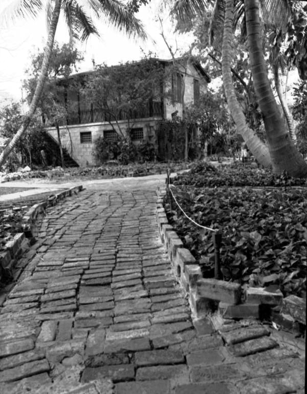View of the brick walkway leading to the rear of the Hemingway House..