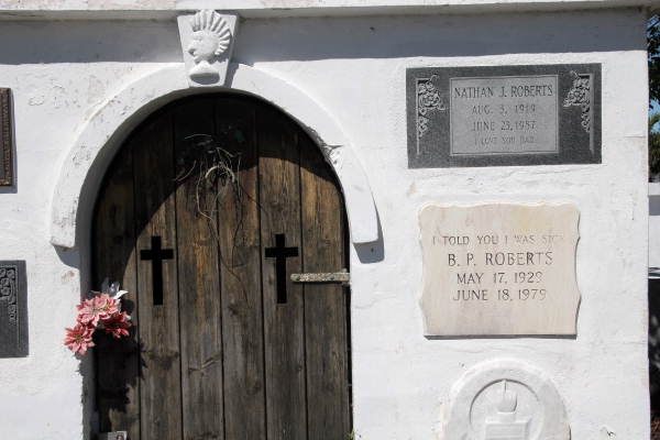 Close-up view of mausoleum with headstone tablets at the Key West Cemetery.